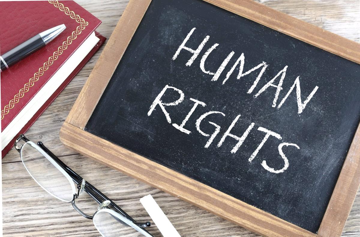 A chalkboard with 'human rights' written on it.